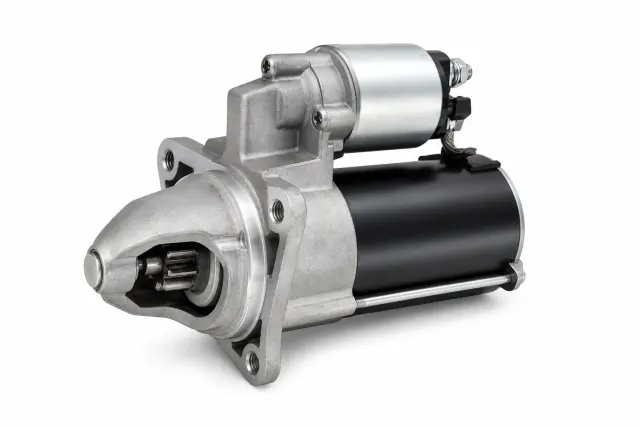 Unbranded automotive starter motor on a white background
